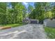 Charming home nestled amongst lush trees, featuring an attached garage and a well-maintained lawn at 5824 Wesley Rdg, Martinsville, IN 46151