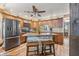 Modern kitchen with stainless steel appliances, granite countertops, and island seating at 5824 Wesley Rdg, Martinsville, IN 46151