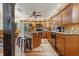 Spacious kitchen with a kitchen island, stainless steel appliances, and wooden cabinetry at 5824 Wesley Rdg, Martinsville, IN 46151