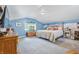 Comfortable bedroom featuring blue walls, carpeted floors, and a queen size bed at 5824 Wesley Rdg, Martinsville, IN 46151