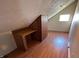 This finished attic space offers a built-in desk, ideal for a home office or creative studio at 5850 Pennekamp Dr, Plainfield, IN 46168