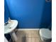 Powder room with pedestal sink, toilet and Indianapolis Colts wall decor at 5850 Pennekamp Dr, Plainfield, IN 46168