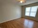 This is a simple bedroom with a ceiling fan and natural light from the window at 5850 Pennekamp Dr, Plainfield, IN 46168