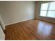 Bedroom with beautiful laminate floors, neutral walls, and bright window at 5850 Pennekamp Dr, Plainfield, IN 46168