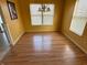 Well-lit dining room featuring laminate floors and a modern chandelier at 5850 Pennekamp Dr, Plainfield, IN 46168