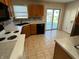 Charming kitchen features tile floors and stainless-steel appliances at 5850 Pennekamp Dr, Plainfield, IN 46168