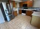 Charming kitchen features tile floors and stainless-steel appliances at 5850 Pennekamp Dr, Plainfield, IN 46168
