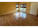Bright living room featuring laminate flooring and two large windows at 5850 Pennekamp Dr, Plainfield, IN 46168