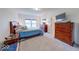 Spacious bedroom with carpet, natural light, and wooden furniture at 59 Manchester Dr, Trafalgar, IN 46181