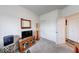 Neutral bedroom includes a television, closet, and carpet flooring at 59 Manchester Dr, Trafalgar, IN 46181