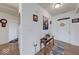 Bright entryway featuring wood floors, decorative wall art, and a welcoming ambiance at 59 Manchester Dr, Trafalgar, IN 46181