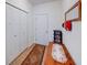 Welcoming entryway features hardwood floors, closet, mirror, and decorative table with storage at 59 Manchester Dr, Trafalgar, IN 46181