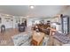 Expansive living area with hardwood floors, comfortable seating, and an open layout to the kitchen at 59 Manchester Dr, Trafalgar, IN 46181