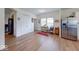 Bright open area features stainless refrigerator and adjacent entry with natural light at 59 Manchester Dr, Trafalgar, IN 46181