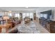 Spacious living room with hardwood floors, comfortable seating, and ample natural light at 59 Manchester Dr, Trafalgar, IN 46181