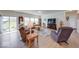 Bright and spacious living room with hardwood floors, comfortable seating, and abundant natural light at 59 Manchester Dr, Trafalgar, IN 46181