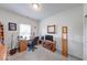 Well-lit office featuring a wooden desk, comfortable chair, and neutral carpet flooring at 59 Manchester Dr, Trafalgar, IN 46181