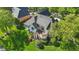 Aerial view of a backyard with a deck and lush green landscaping at 5940 Chapmans Trl, Carmel, IN 46033