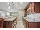 Basement bar with wood cabinets, neutral countertops, and seating at 5940 Chapmans Trl, Carmel, IN 46033