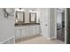 Bathroom featuring double sink vanity, tile floors, and neutral color walls at 5940 Chapmans Trl, Carmel, IN 46033