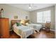 Comfortable bedroom featuring two twin beds, hardwood floors, and plenty of natural light at 5940 Chapmans Trl, Carmel, IN 46033