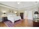 An angled view of the bedroom, which features a bed and doorway leading to other rooms at 5940 Chapmans Trl, Carmel, IN 46033