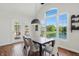 Dining room boasts a picturesque view of the water and access to the sunroom at 5940 Chapmans Trl, Carmel, IN 46033
