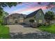 Traditional style home with brick facade, well-manicured lawn, and attached two-car garage at 5940 Chapmans Trl, Carmel, IN 46033