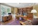 Well-appointed home office featuring custom built-ins, two desks, and ample natural light at 5940 Chapmans Trl, Carmel, IN 46033