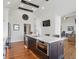 Gourmet kitchen with custom cabinets, island with marble countertops, and stainless steel appliances at 5940 Chapmans Trl, Carmel, IN 46033