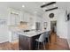 Gourmet kitchen with custom cabinets, an island with marble countertops, and stainless steel appliances at 5940 Chapmans Trl, Carmel, IN 46033