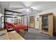 Spacious main bedroom featuring a four-poster bed, sauna, and wood furniture at 5940 Chapmans Trl, Carmel, IN 46033