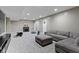 Relaxing finished basement offers ample seating, a cozy fireplace, and room for recreation and entertainment at 6107 Flagler Ln, Brownsburg, IN 46112