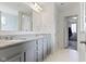 Bathroom featuring a double vanity with gray cabinets and a marble tile floor at 6107 Flagler Ln, Brownsburg, IN 46112