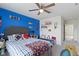 This bedroom features a blue accent wall and is decorated with assorted sports memorabilia at 6107 Flagler Ln, Brownsburg, IN 46112