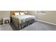 Cozy carpeted bedroom features neutral paint and a comfortable bed perfect for relaxing after a long day at 6107 Flagler Ln, Brownsburg, IN 46112