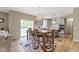 Open-concept kitchen and dining area with modern lighting, updated appliances, and stylish decor at 6107 Flagler Ln, Brownsburg, IN 46112