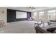 Large, versatile living room with a projector screen and a comfortable seating area perfect for entertaining at 6107 Flagler Ln, Brownsburg, IN 46112