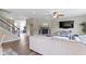 Spacious living room with hardwood floors, fireplace, and seamless flow to other living areas at 6107 Flagler Ln, Brownsburg, IN 46112