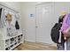 Well-organized mudroom entry with coat hooks, shoe storage, and a convenient bench for everyday use at 6107 Flagler Ln, Brownsburg, IN 46112