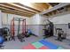 Workout room with weightlifting equipment, mats, and an unfinished ceiling with exposed beams at 6107 Flagler Ln, Brownsburg, IN 46112