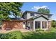 Backyard featuring mature trees, a patio with seating, and a well-manicured lawn at 6133 Buttonwood Dr, Noblesville, IN 46062