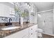 Stylish bathroom featuring double sinks, granite counters, modern fixtures, and a glass shower at 6133 Buttonwood Dr, Noblesville, IN 46062