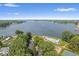 Wide aerial view of community amenities, including tennis courts, a pool, and lake access at 6133 Buttonwood Dr, Noblesville, IN 46062