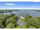 Aerial view of community amenities including tennis courts, a pool, and lake access at 6133 Buttonwood Dr, Noblesville, IN 46062