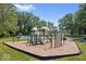 Community playground with slides, climbing equipment, and swings at 6133 Buttonwood Dr, Noblesville, IN 46062