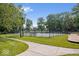 Community tennis court with a playground nearby at 6133 Buttonwood Dr, Noblesville, IN 46062