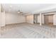 Spacious finished basement with gray carpet, recessed lighting, and sliding barn door at 6160 Hardwick Dr, Whitestown, IN 46075