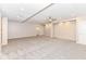 Spacious basement with neutral carpet, ceiling fan, recessed lighting and easy access to other rooms at 6160 Hardwick Dr, Whitestown, IN 46075
