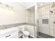 This bathroom features a tiled shower, and white vanity, complemented by the patterned backsplash tile at 6160 Hardwick Dr, Whitestown, IN 46075